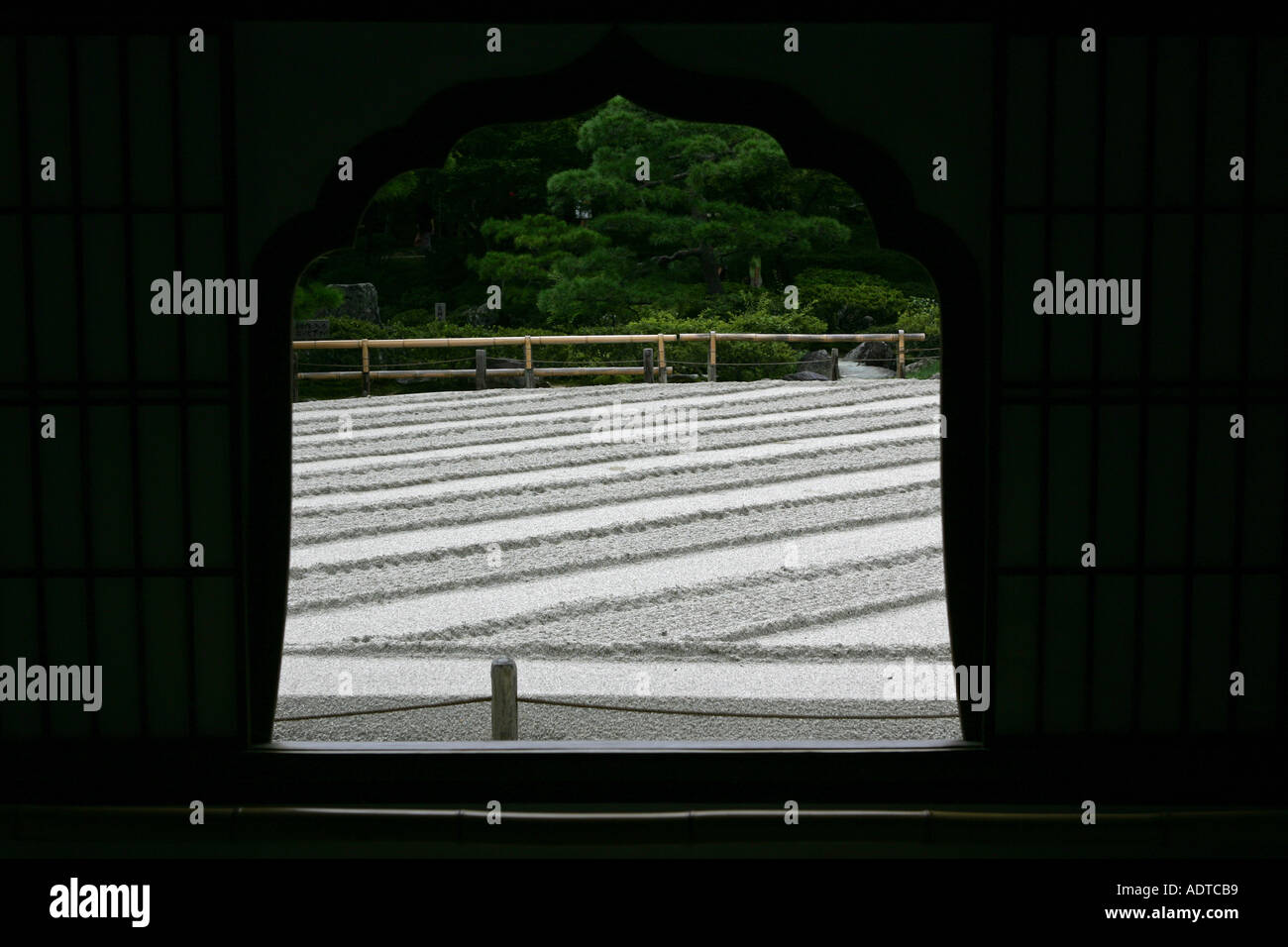 Window view through to the main silver sand zen sculpted garden at the silver temple in ancient Koyoto Japan Asia Stock Photo