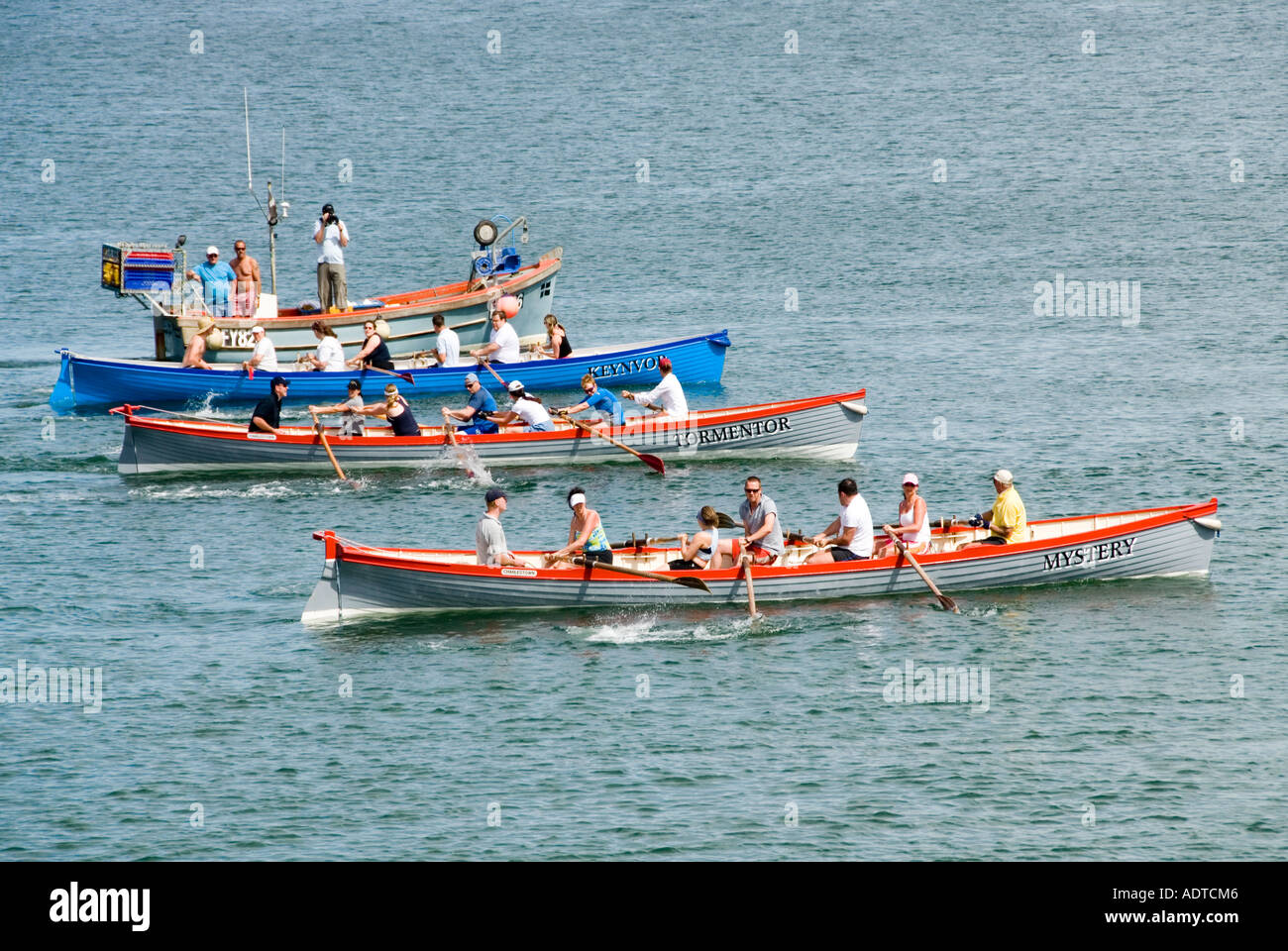 Off Charlestown shoreline mixed crew rowers in three teams long pilot ...