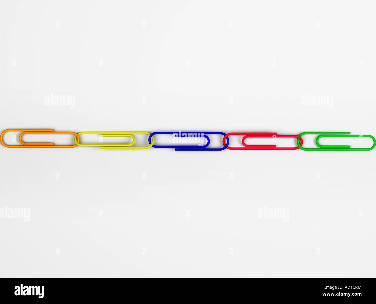 Multi colored paper clips in row Stock Photo
