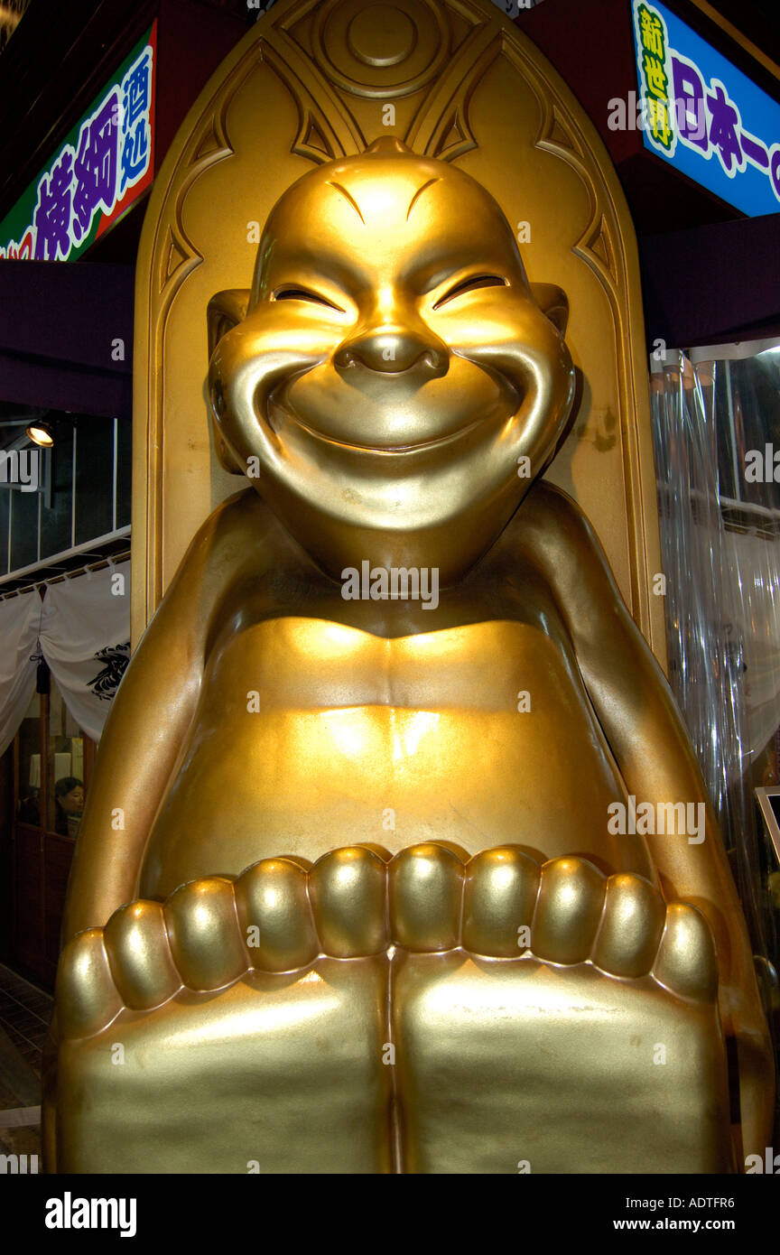 Giant gold figure Tenoji Osaka Japan Stock Photo