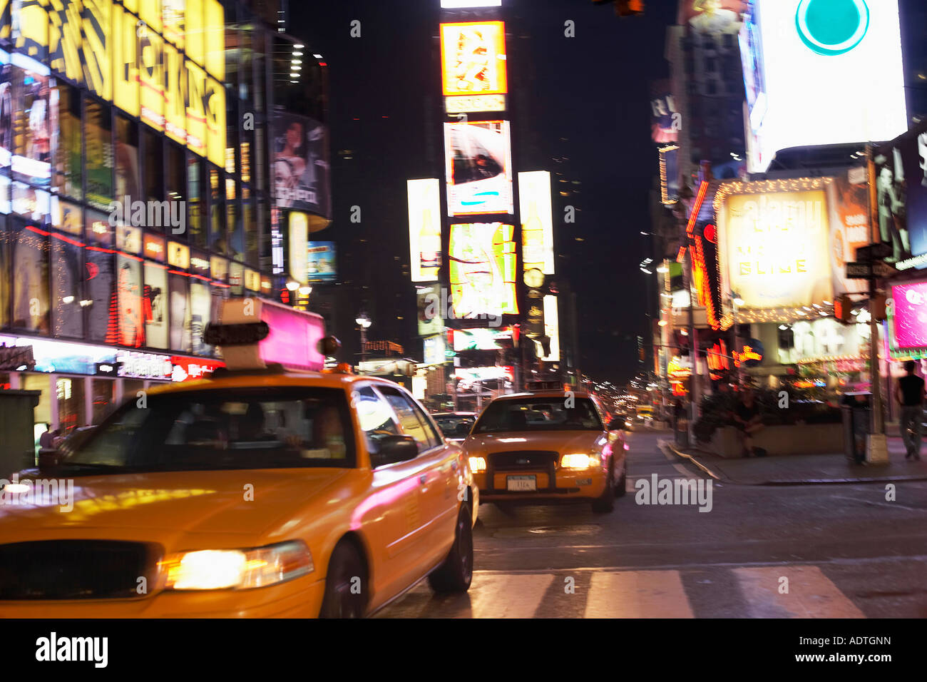 Yellow Taxis on City Street at Night Stock Photo - Alamy