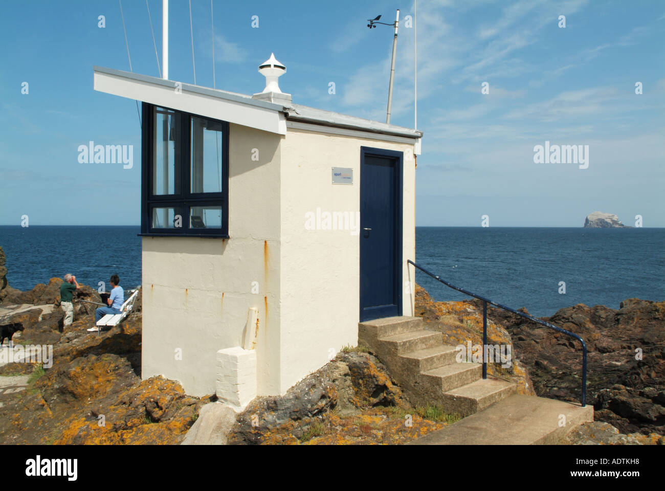Ex-coastguard lookout post on rocks at North Berwick Stock Photo