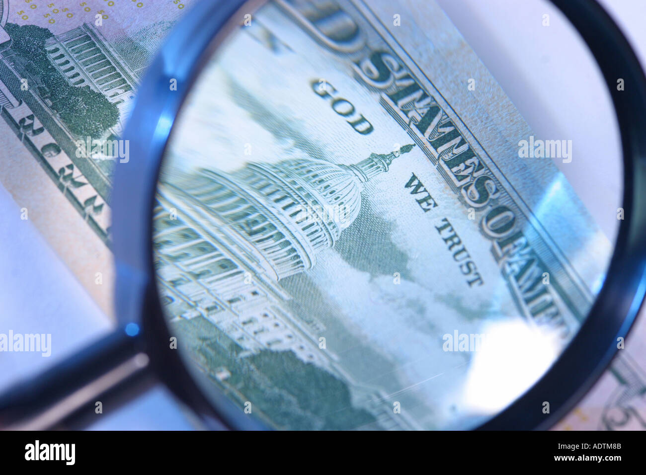 Dollar note with magnifying glass Stock Photo