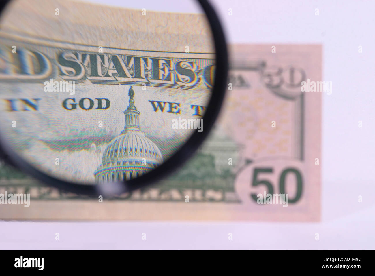 Dollar note with magnifying glass Stock Photo