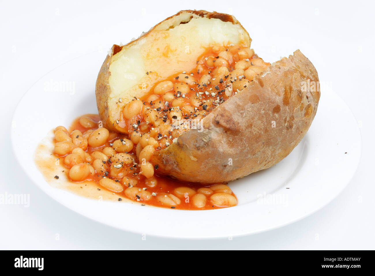 Baked Fresh Jacket Potato With Baked Beans In Tomato Sauce Isolated