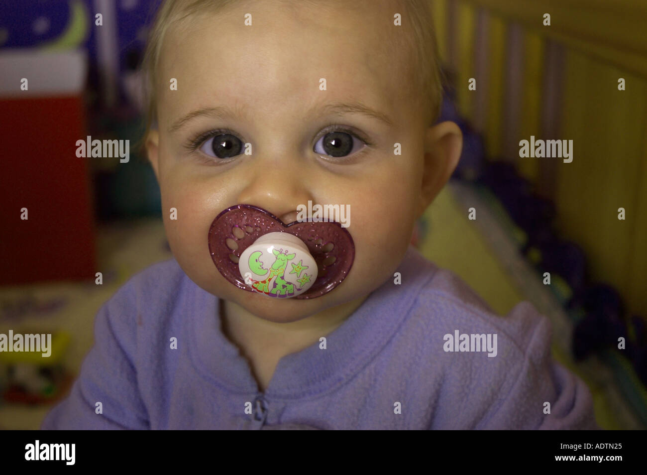 baby in crib with pacifier Stock Photo Alamy