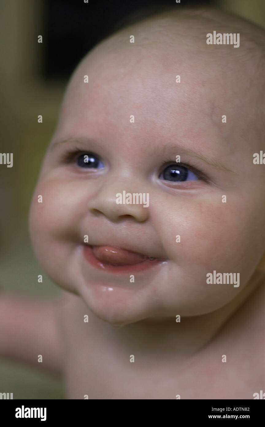 Baby With Tongue Out Stock Photo Alamy when-the-baby-keeps-sleeping-on-your-body-but-wakes-up-the-moment-you