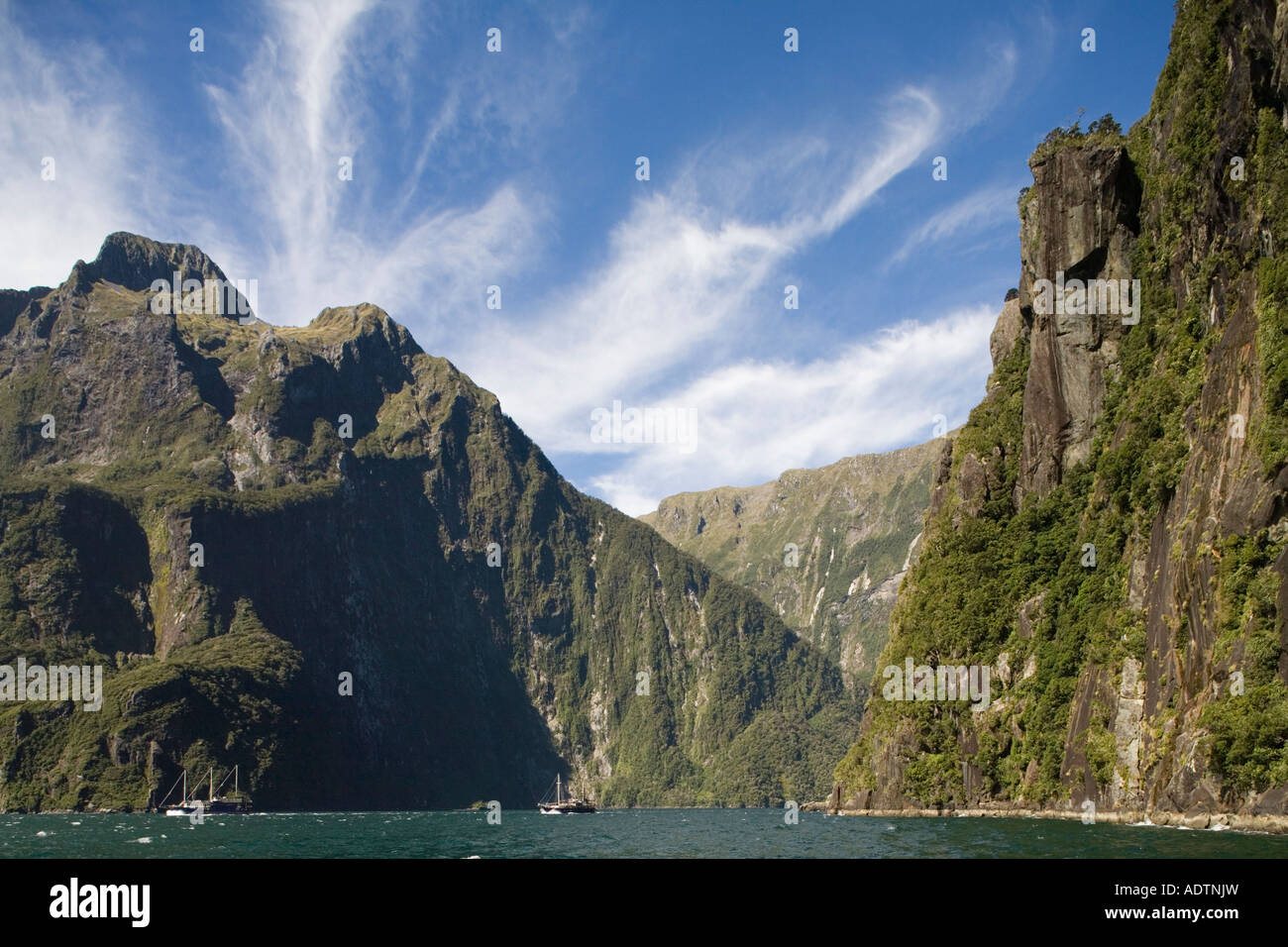 New Zealand South Island Fiordland National Park Steep cliffs line ...