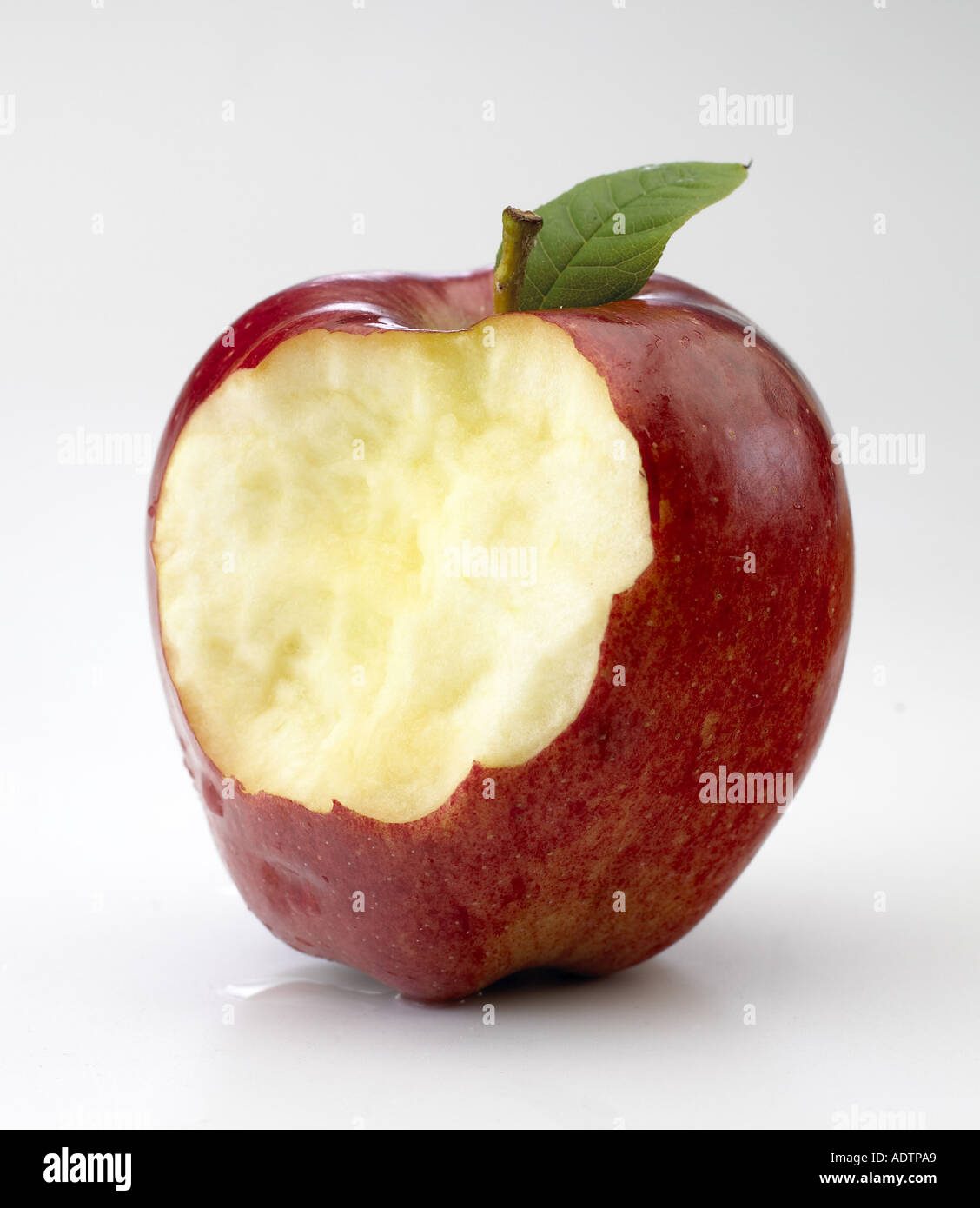 Red apple with bite taken Stock Photo