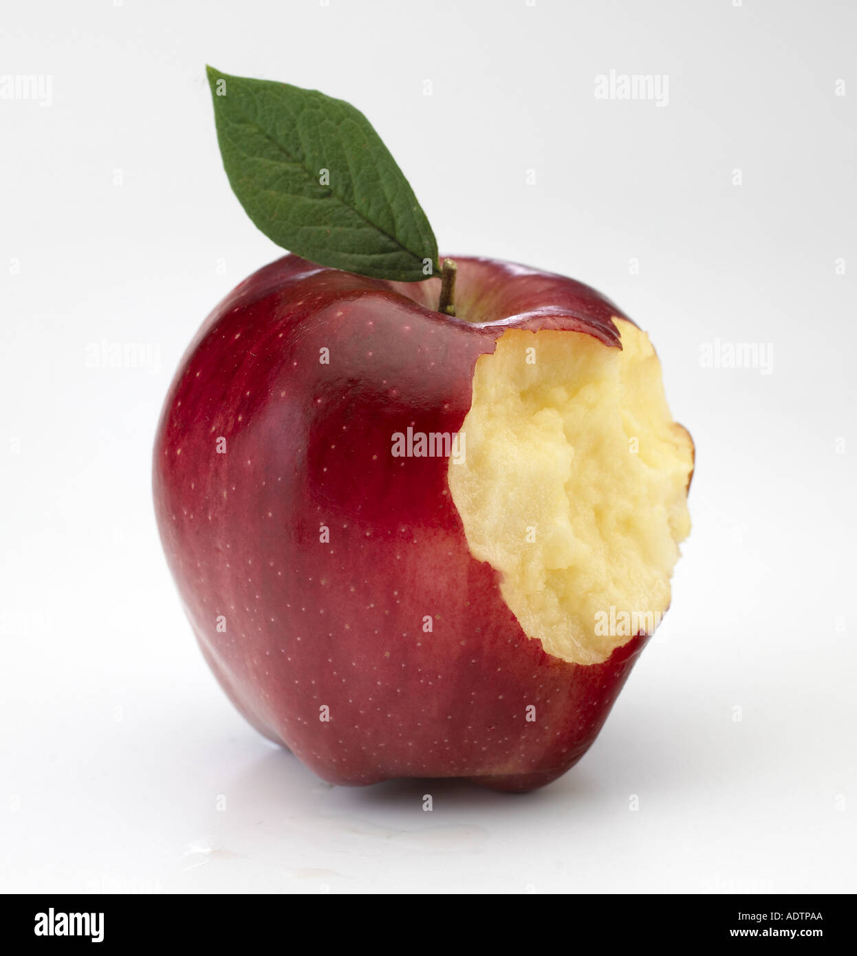 Red apple with bite taken Stock Photo Alamy