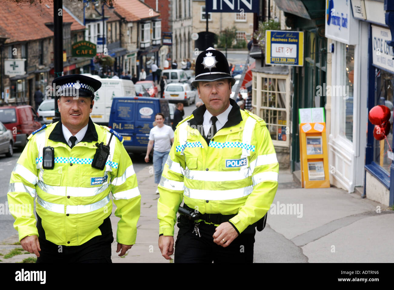 Policeman and Community Safety Officer patrol the High street of
