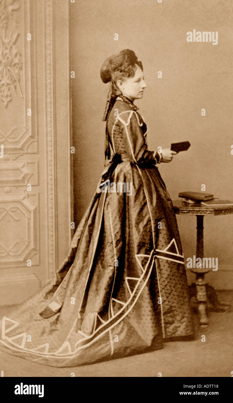 Original CDV (Carte de Visite) formal portrait of Victorian woman holding book, U.K. Stock Photo