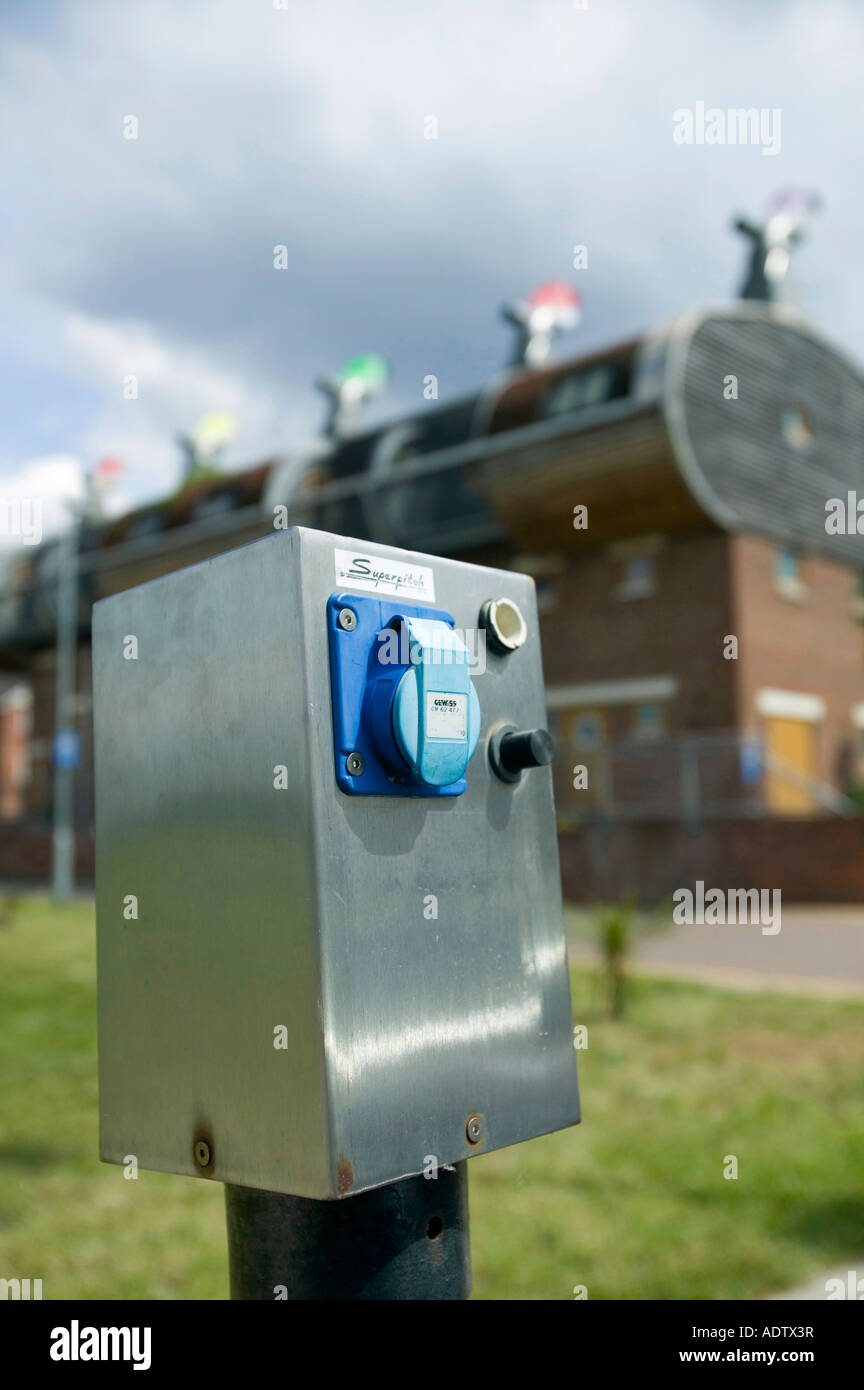 A an electric car charging point at Bedzed the UK s largest eco village Beddington London UK Stock Photo