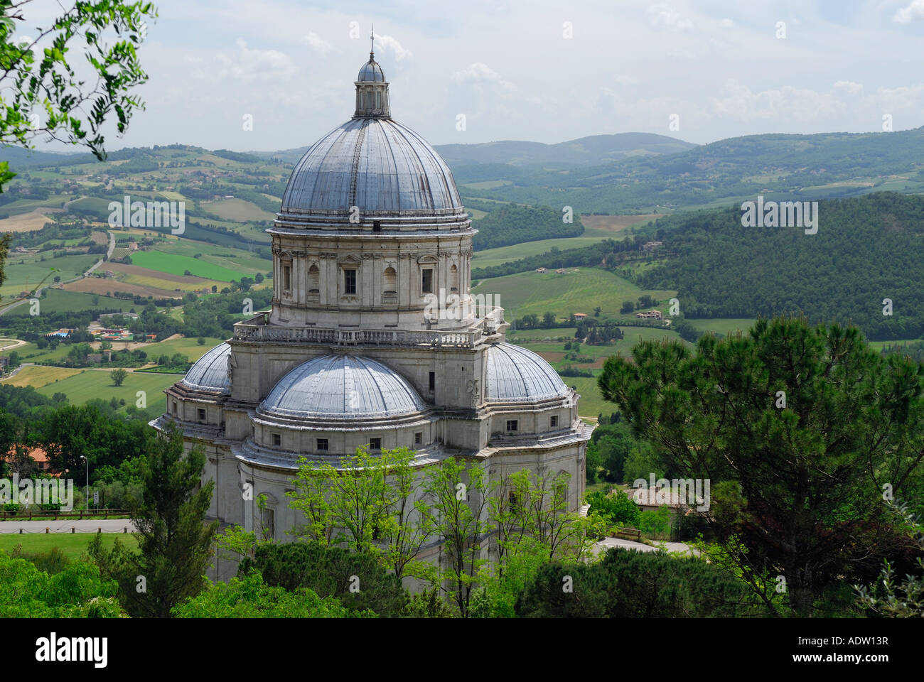 Santa Maria della Consolazione Saint Mary Consolation catholic church domes with pasterland in Todi Umbria Italy Stock Photo