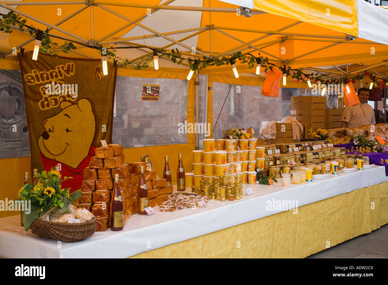Outdoor French Market food stall counter under canopy displaying food