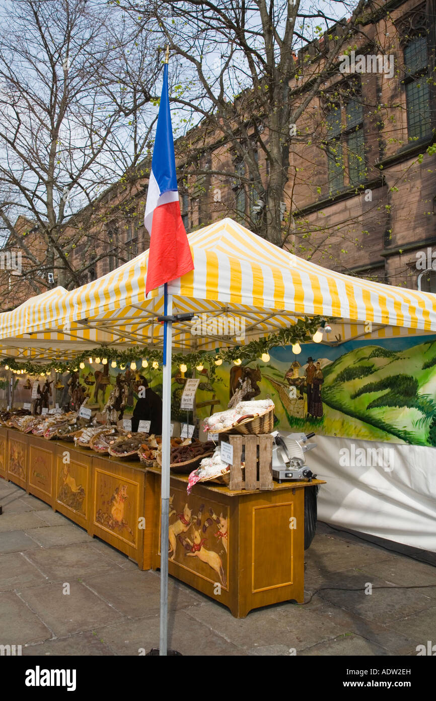 French Market food stall under white yellow canopies displaying