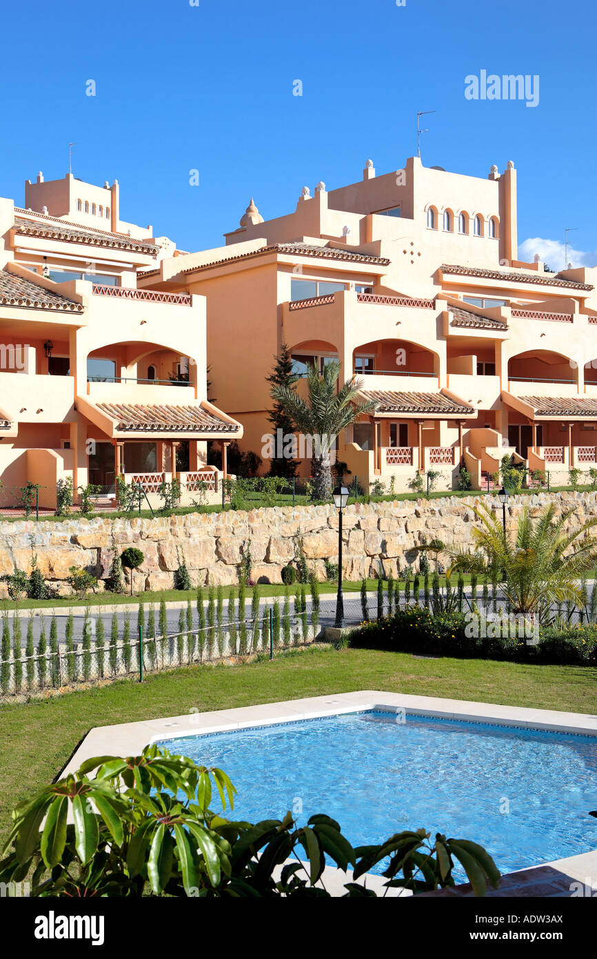 Sunny and compact apartment block on Spanish urbanisation with swimming