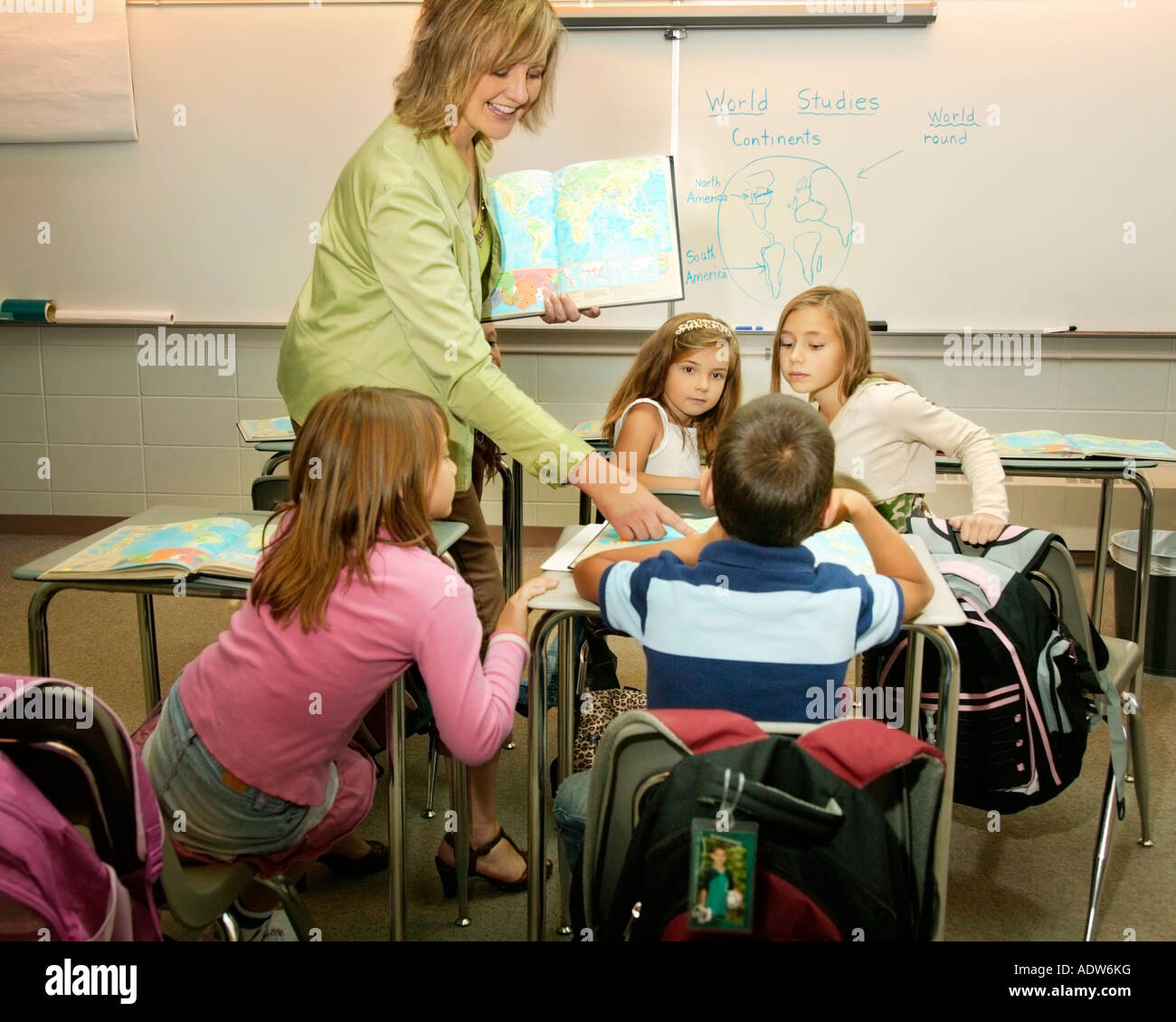 Teacher instructing in a classroom Stock Photo