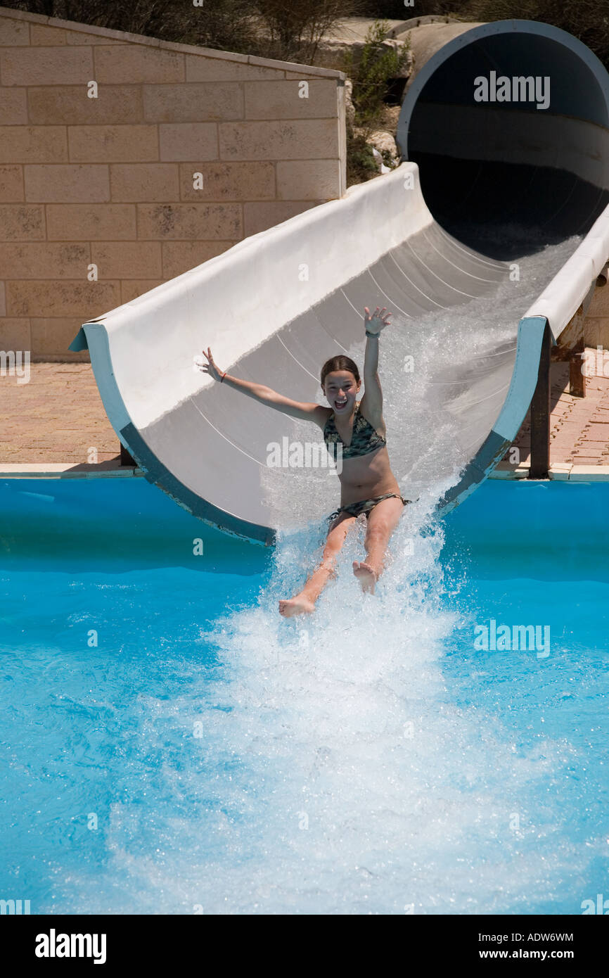 Stock Photo of Happy Young 12 Yo Girl in Bikini On Water Slide Stock Photo  - Alamy