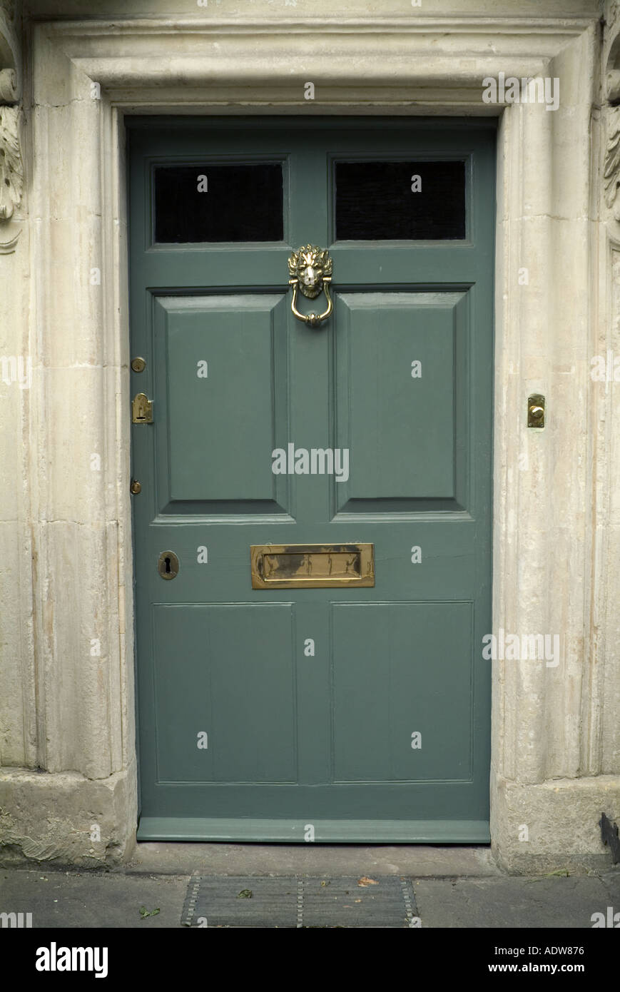 UK England Cotswolds Wiltshire Castle Coombe panelled green door JMH0423 Stock Photo