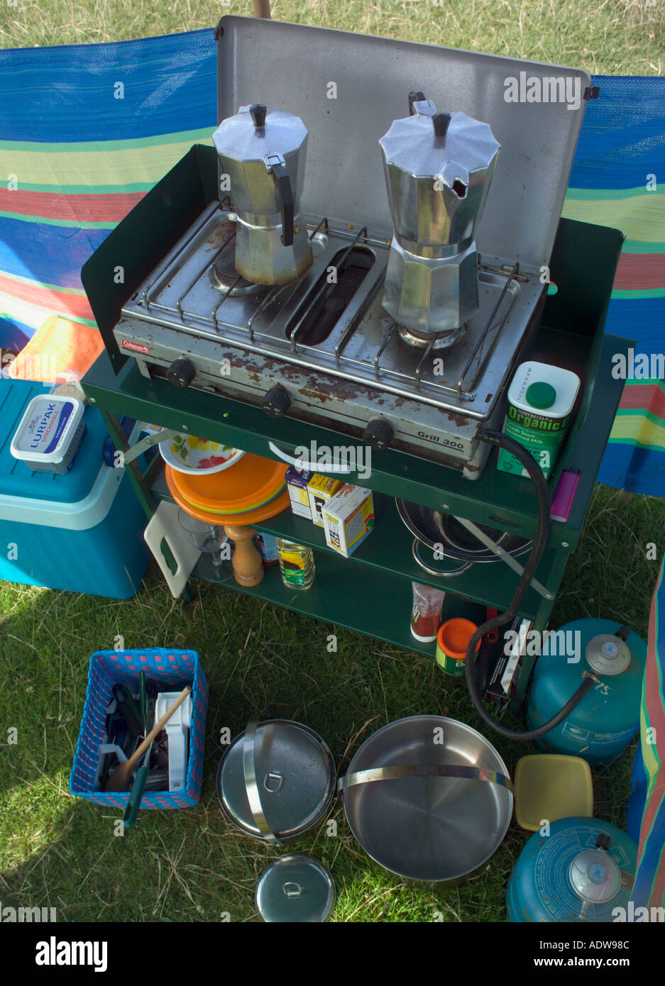 Camping equipment camp kitchen with pots pans and cooker Stock Photo