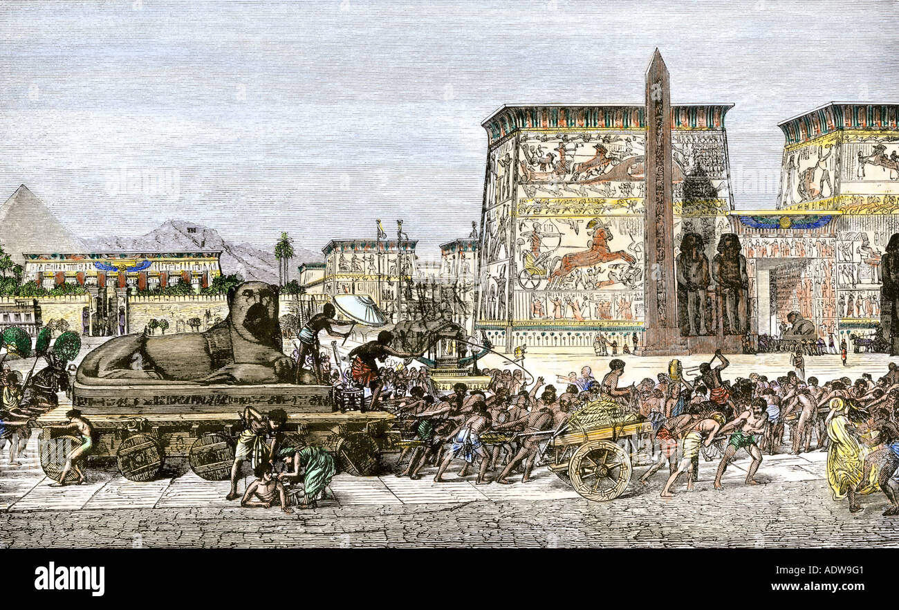 Slaves in ancient Egypt constructing monuments and buildings. Hand-colored woodcut Stock Photo