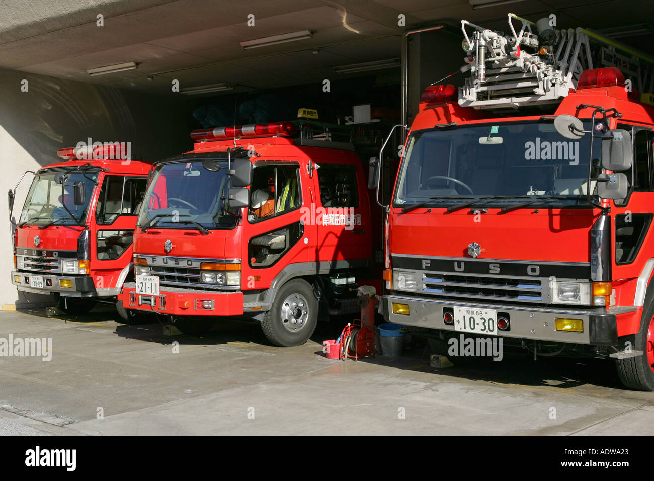 Japanese fire service brigade trucks wait for the next call at a fire