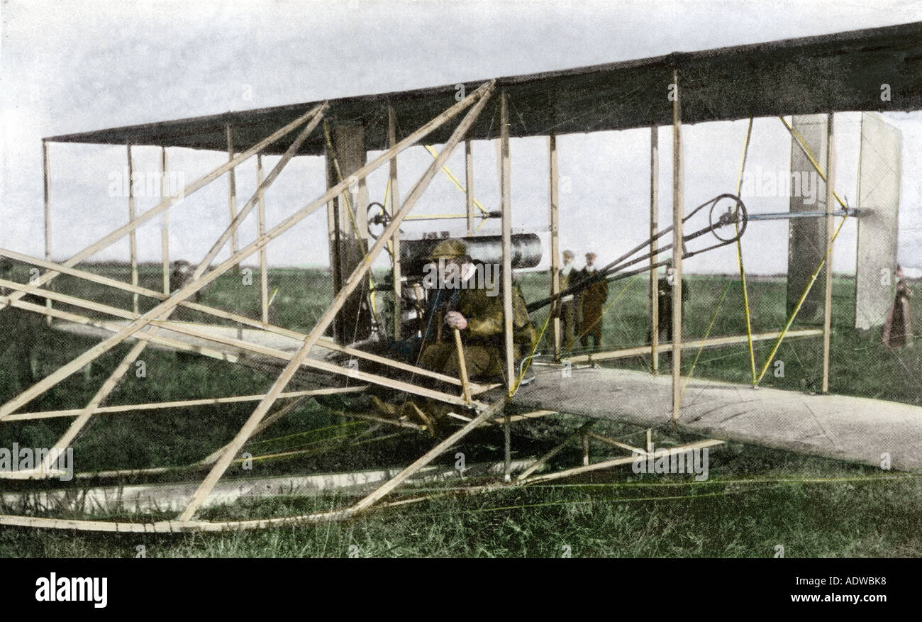 Wilbur Wright with his pupil Monsieur Cassandier in a Wright airplane early 1900s. Hand-colored halftone of a photograph Stock Photo