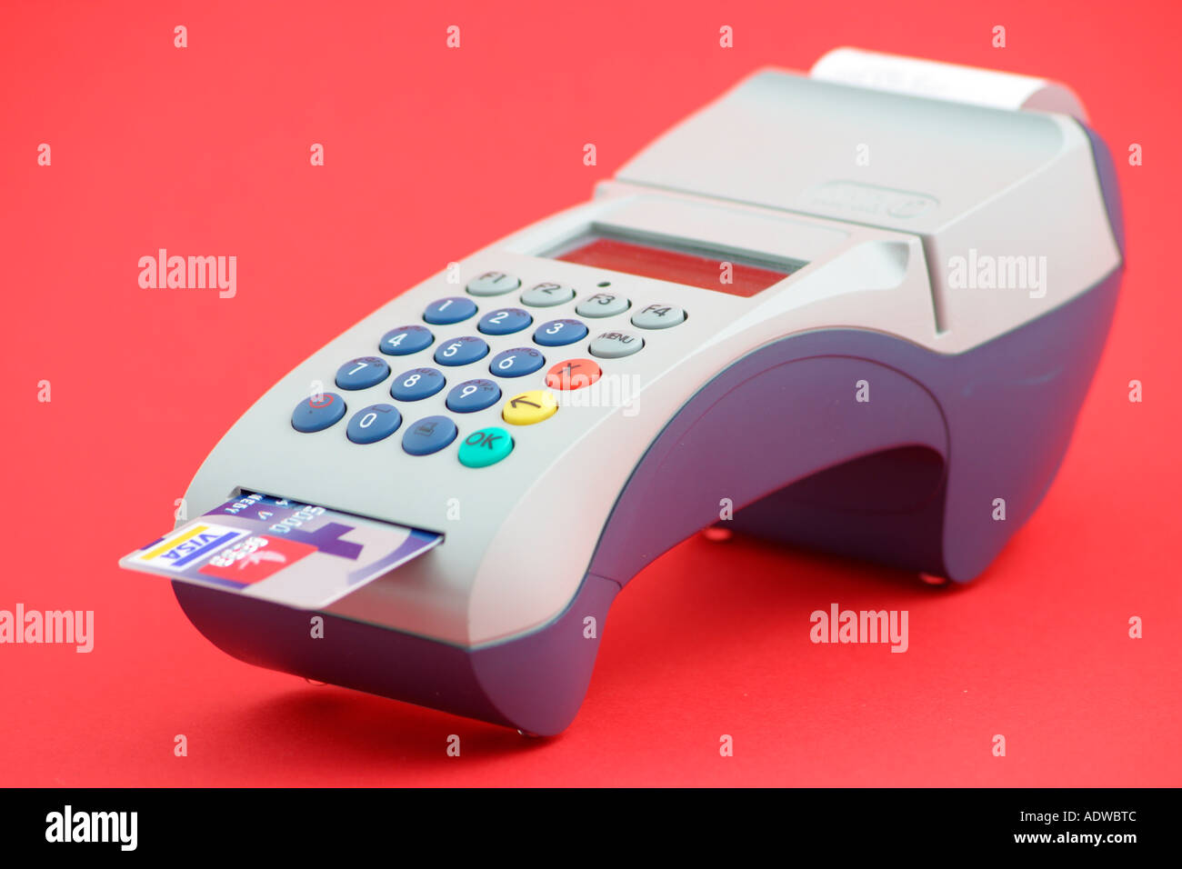 Credit card reader on a red background Stock Photo Alamy