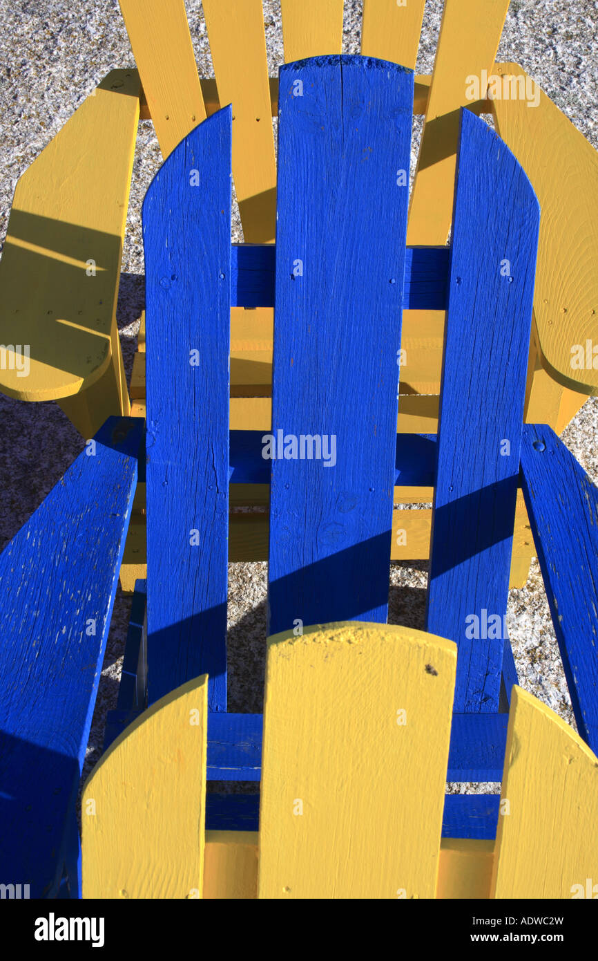 detail of yellow and blue Adirondack chair at the beach, Nova Scotia, NS, Canada.  Photo by Willy Matheisl Stock Photo