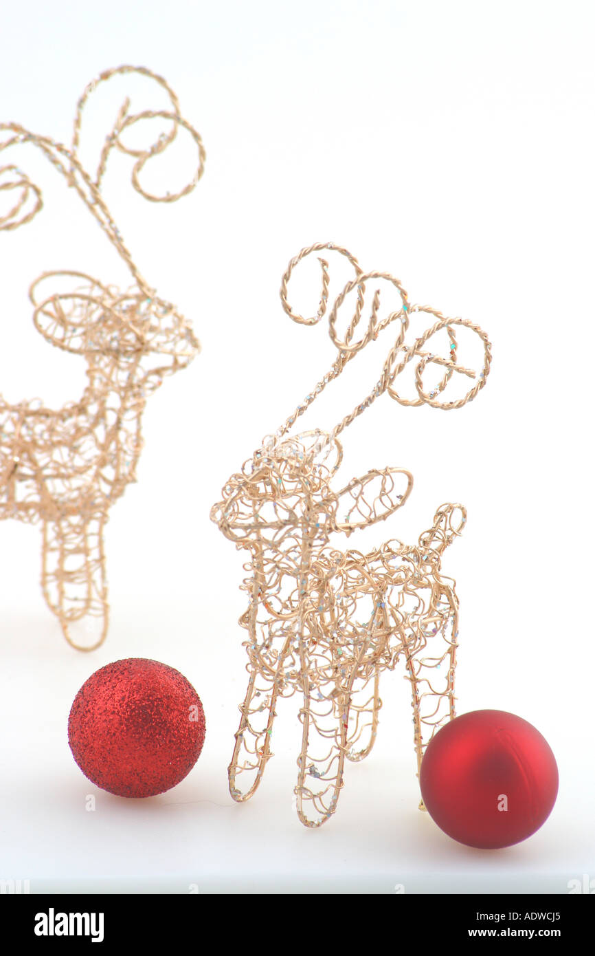 2 Gold Wire Reindeer Christmas Decorations With Red Baubles Stock
