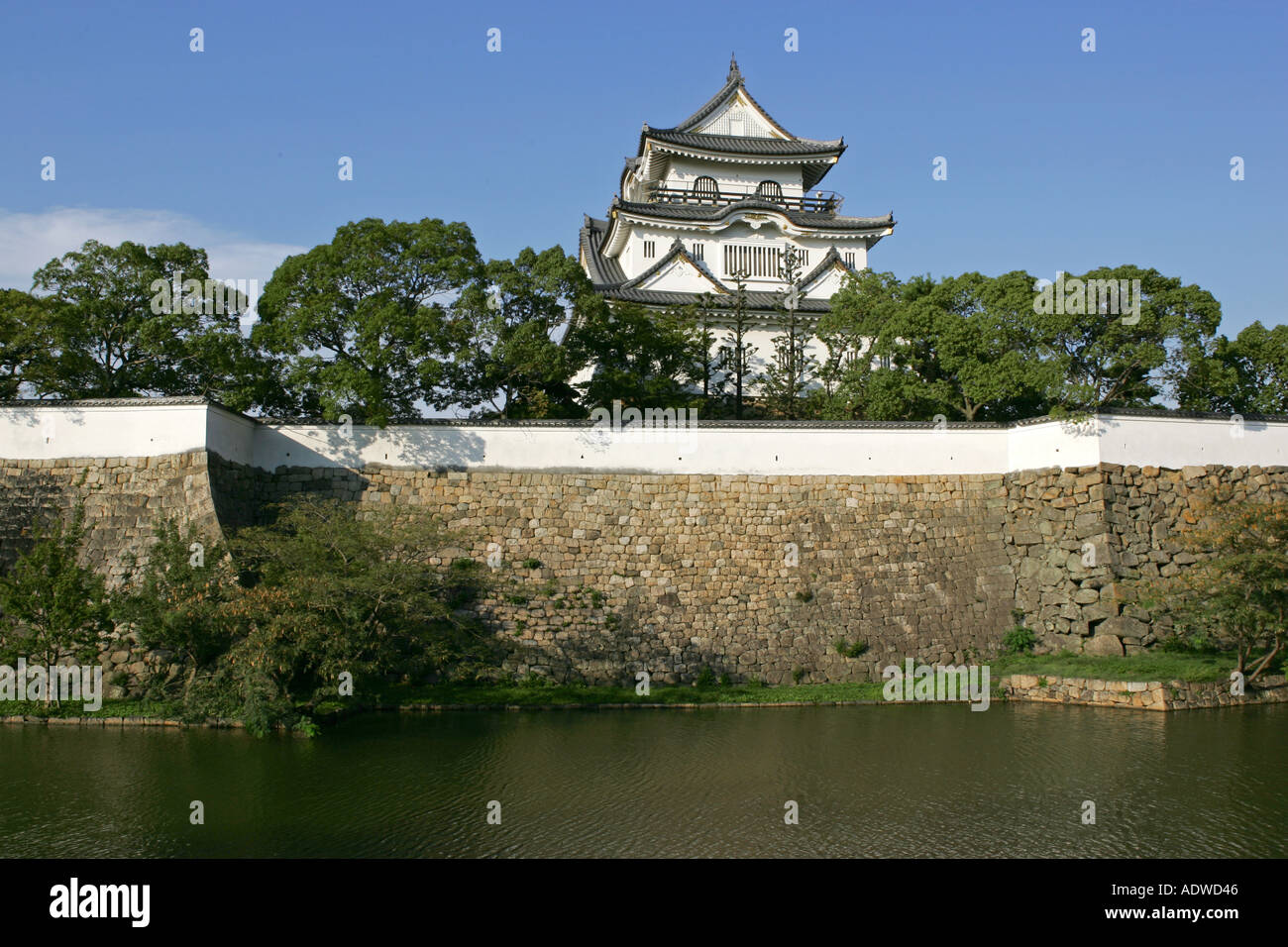 Kishiwada Jo castle wall and moat against a perfect cloudless blue sky Japan Asia Stock Photo