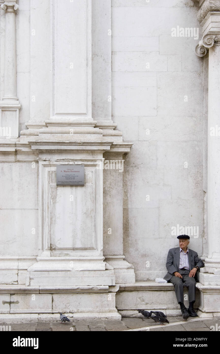 Old man resting outside Santa Maria Formosa church, Venice Stock Photo