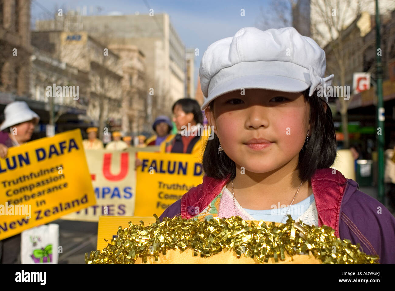 A Young Girl in a Falun Gong (Dafa) Parade, Calling for Human Rights in China. Melbourne, Australia. Stock Photo