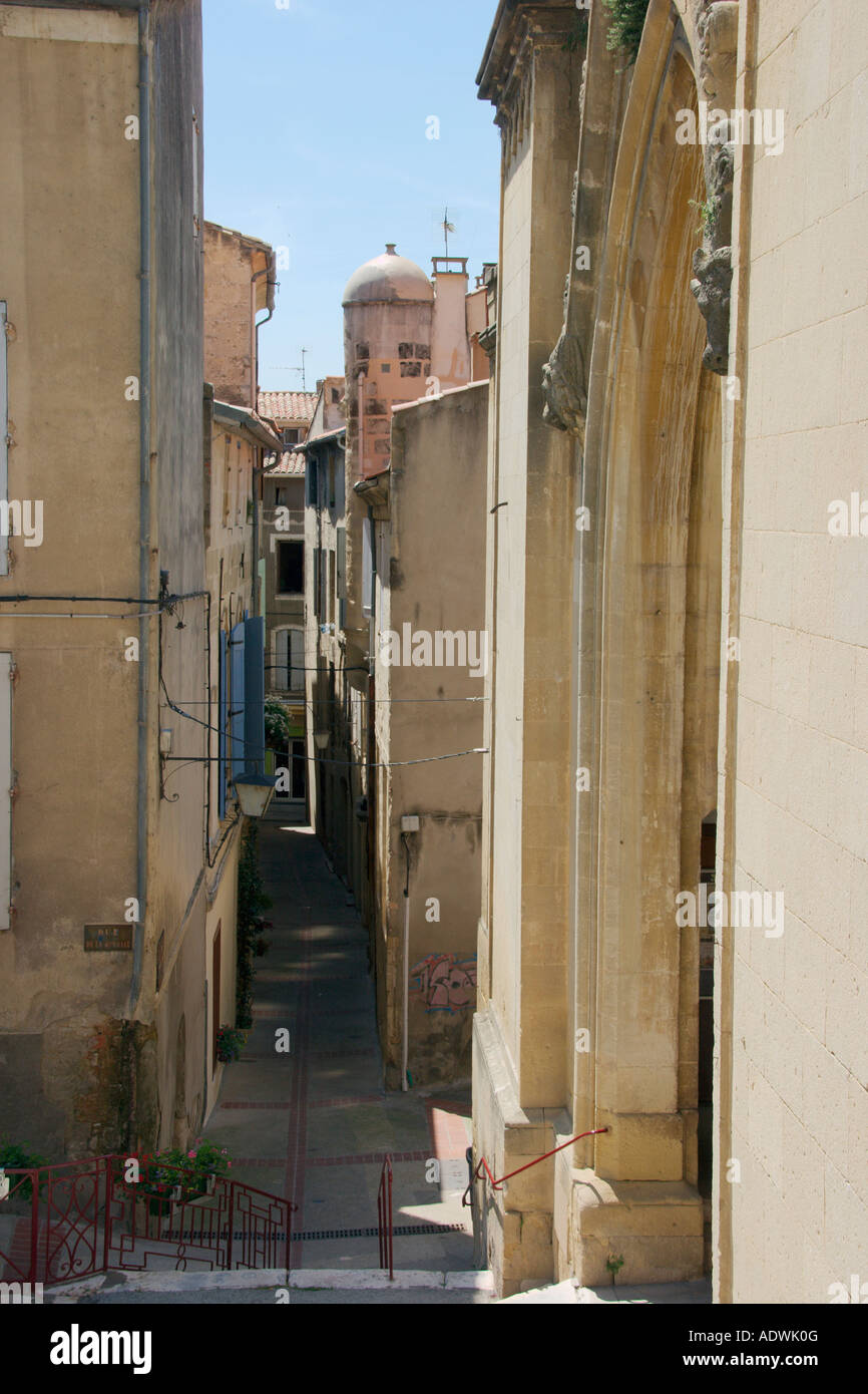 A view down one of the many narrow streets in Sommieres in the Gard Languedoc Roussillon. The South of France. Stock Photo