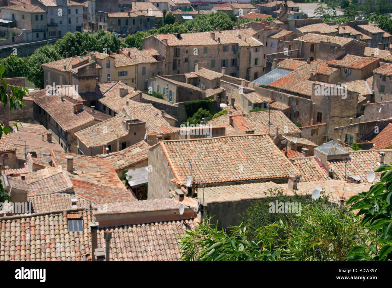 A view over the rooftops of Sommieres in the Gard Languedoc Roussillon. The South of France. Stock Photo
