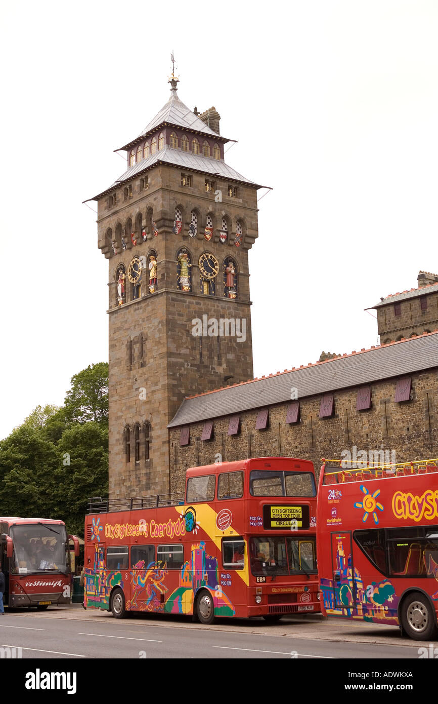 Wales Cardiff Centre Castle open topped tour bus below clock tower Stock Photo