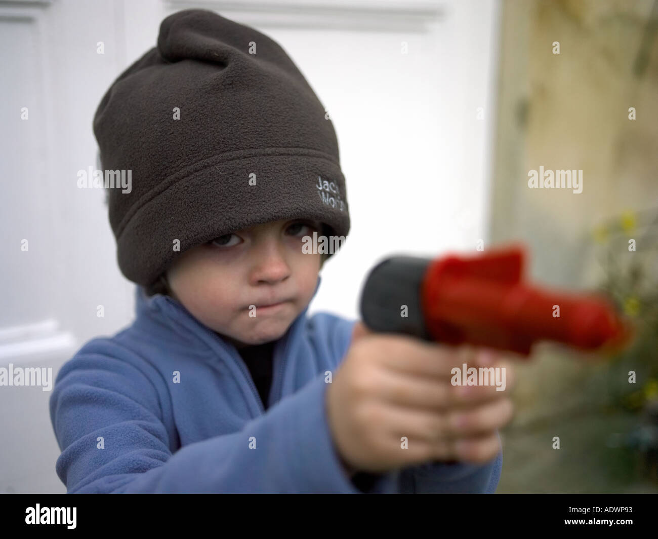 boy aiming plastic gun Stock Photo Alamy