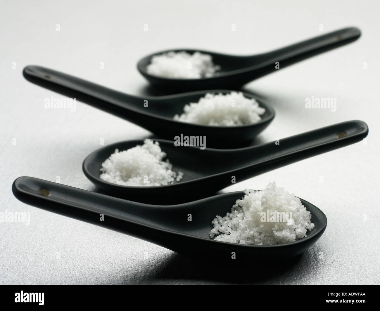 piles natural sea salt in Japanese soup spoons Stock Photo Alamy
