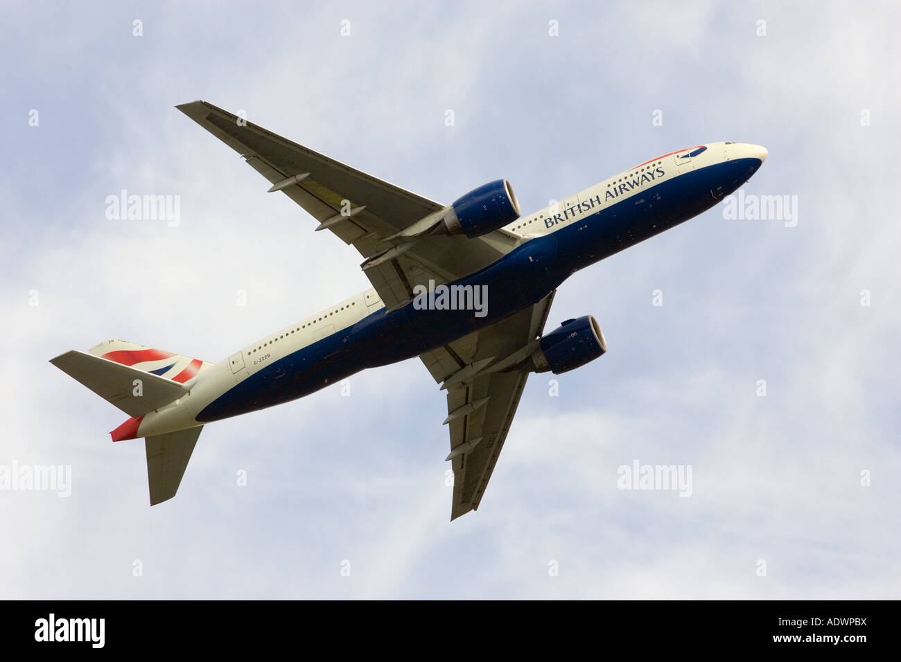 British Airways jet aircraft flying away from Heathrow London United Kingdom Stock Photo