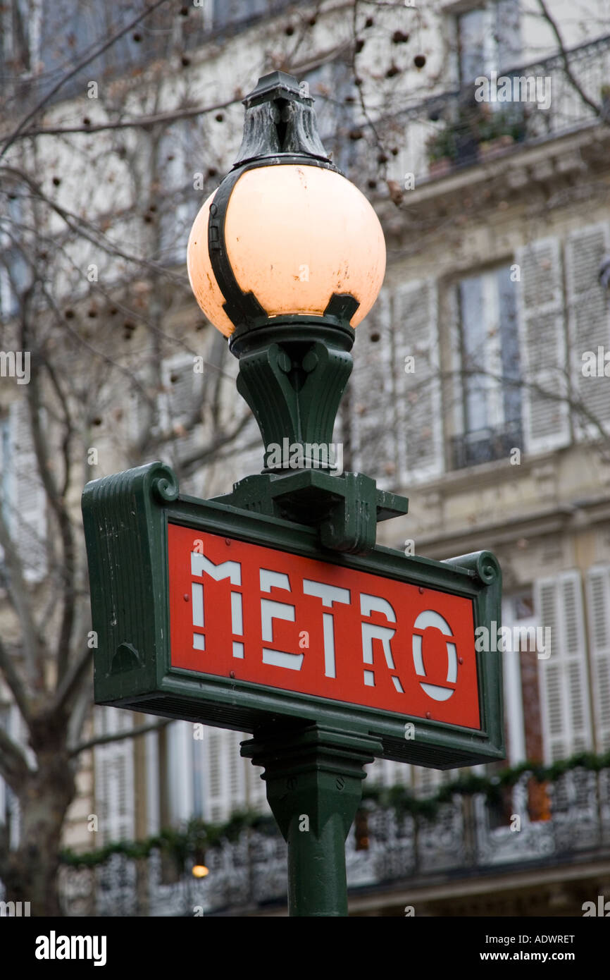 Metro sign in front of typical Paris architecture Boulevard Saint