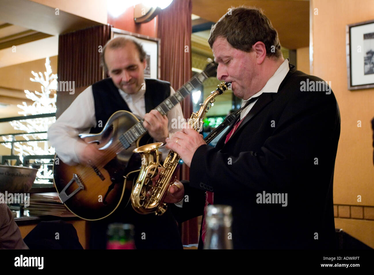 Jazz musicians play music at Brasserie Bowfinger on New Year s Eve Paris France Stock Photo
