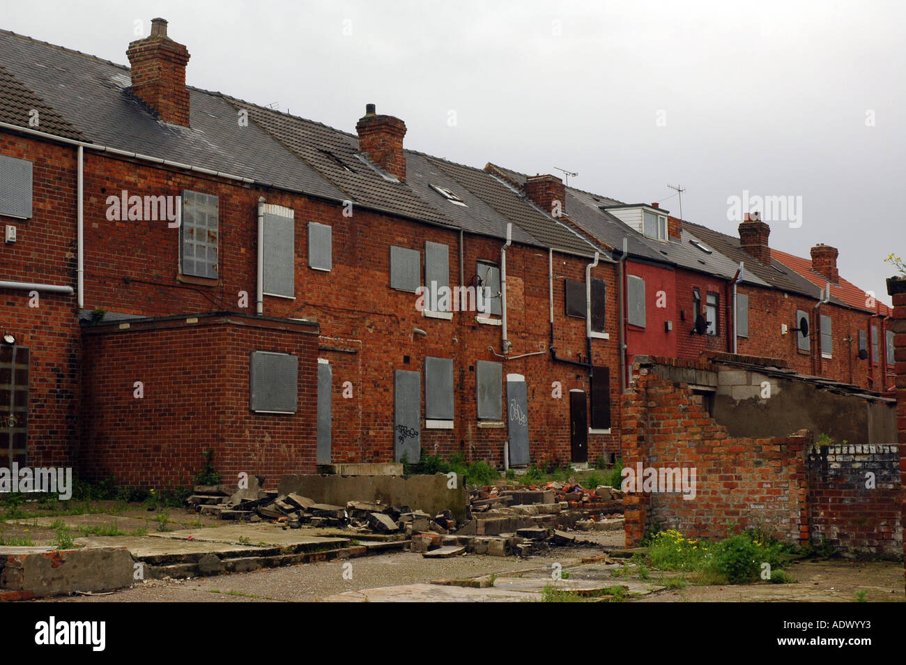 Derelict row of empty terrace houses awaiting demolition at former