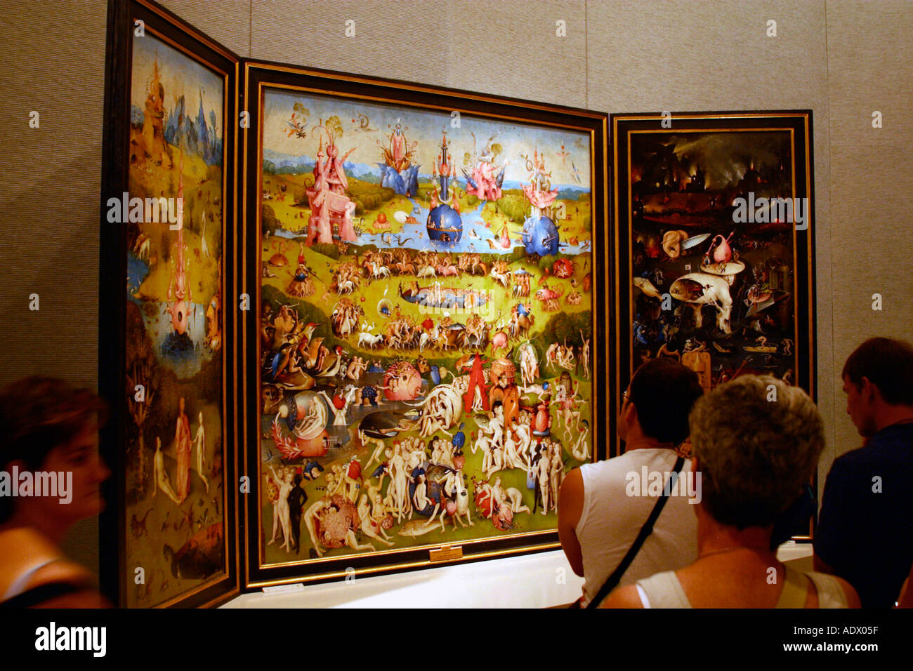 Museo del Prado Museum tourists admire Garden of Earthly Delights by Hieronymus Bosch Spain Stock Photo