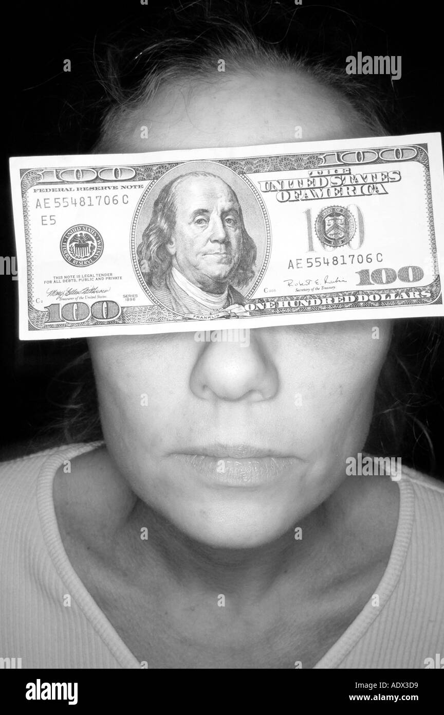 Woman with 100 dollar bill note over eyes on head Stock Photo