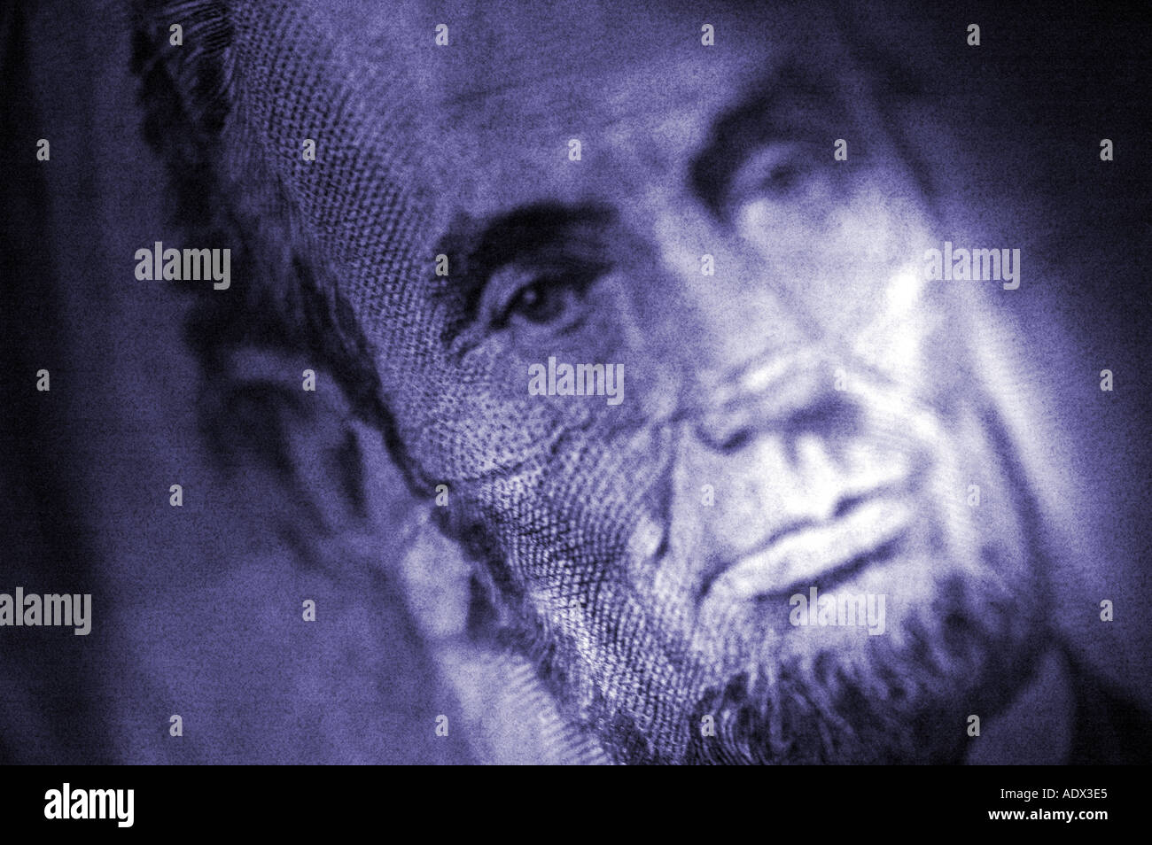 Close up of Abraham Lincoln s face on the rear back of a five 5 dollar bill note money Stock Photo