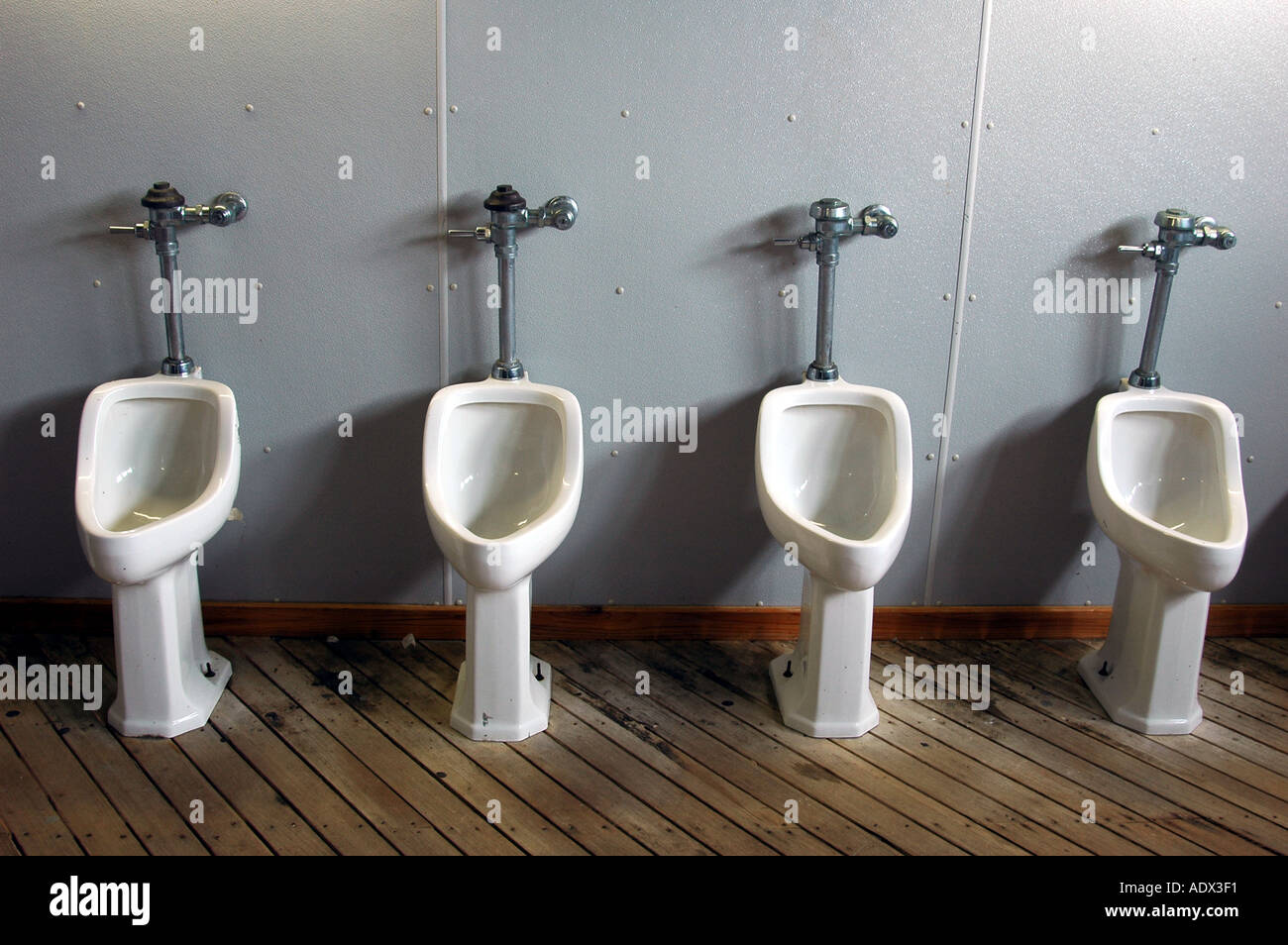 A row of urinals in a bathroom Stock Photo Alamy