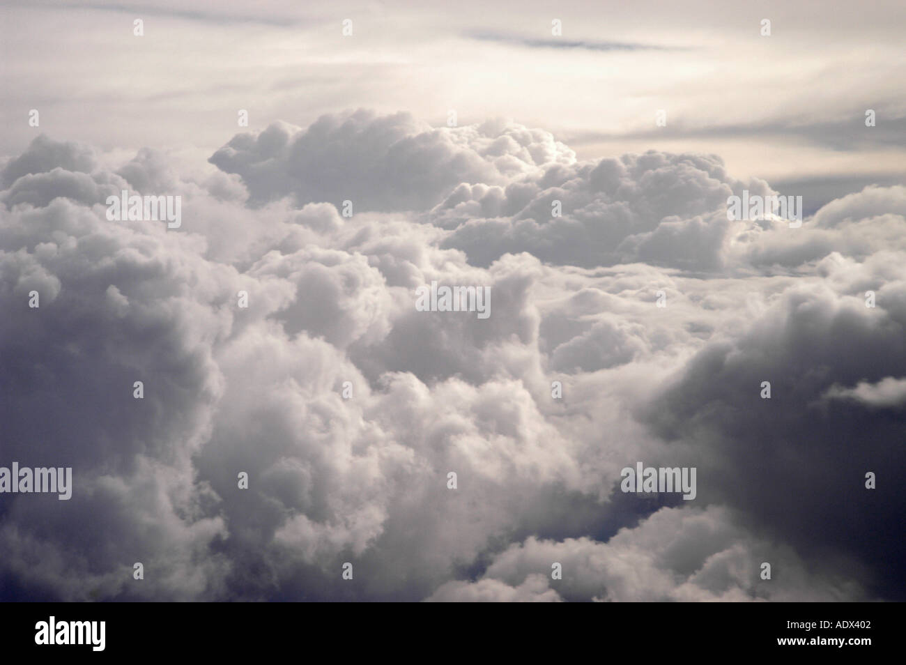 Flying high above the clouds at sunset Stock Photo - Alamy