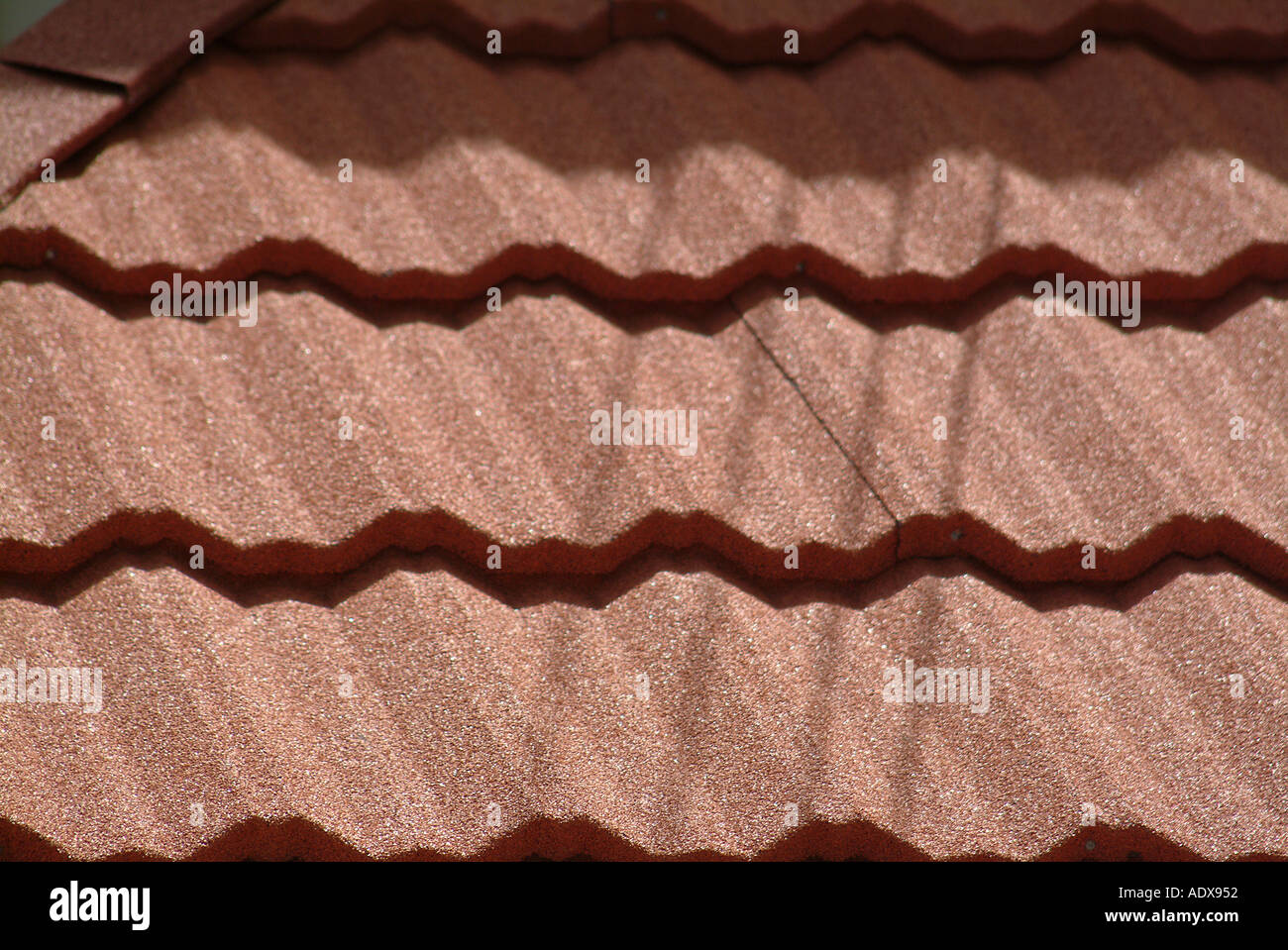 Architecture sunny tiles shingles brownish roof rooftop reddish layers symmetric geometric concept detail closeup architecture Stock Photo
