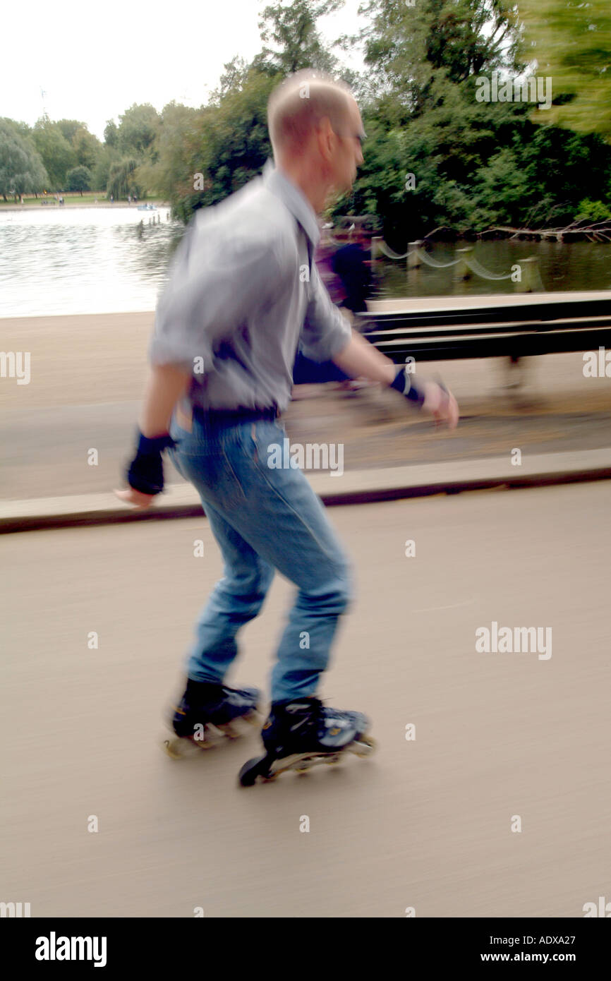 A man rollerblades through London's Hyde Park. Stock Photo